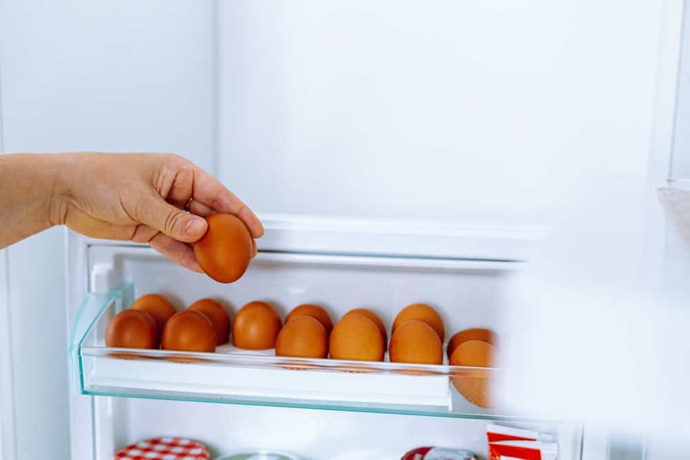 A bowl with eggs sitting in warm water to bring them to room temperature.